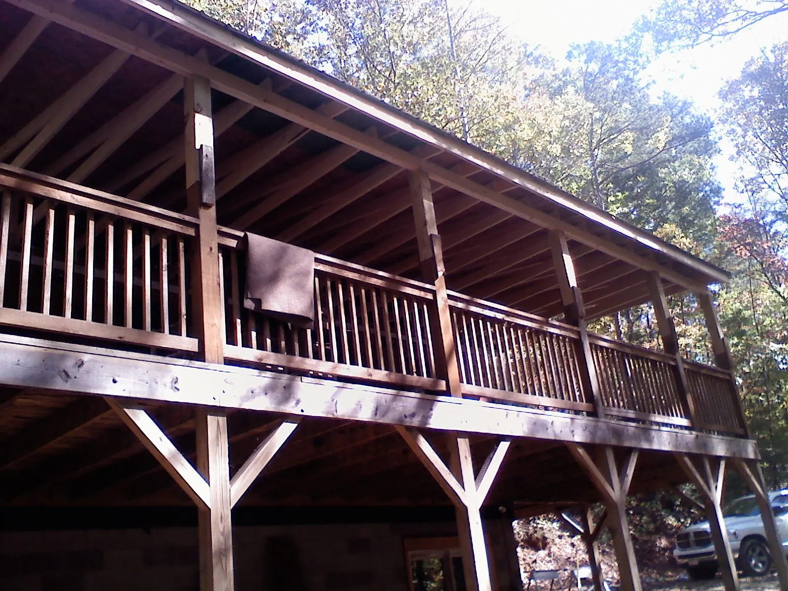 Timber framing under a new elevated porch and deck in New Milford